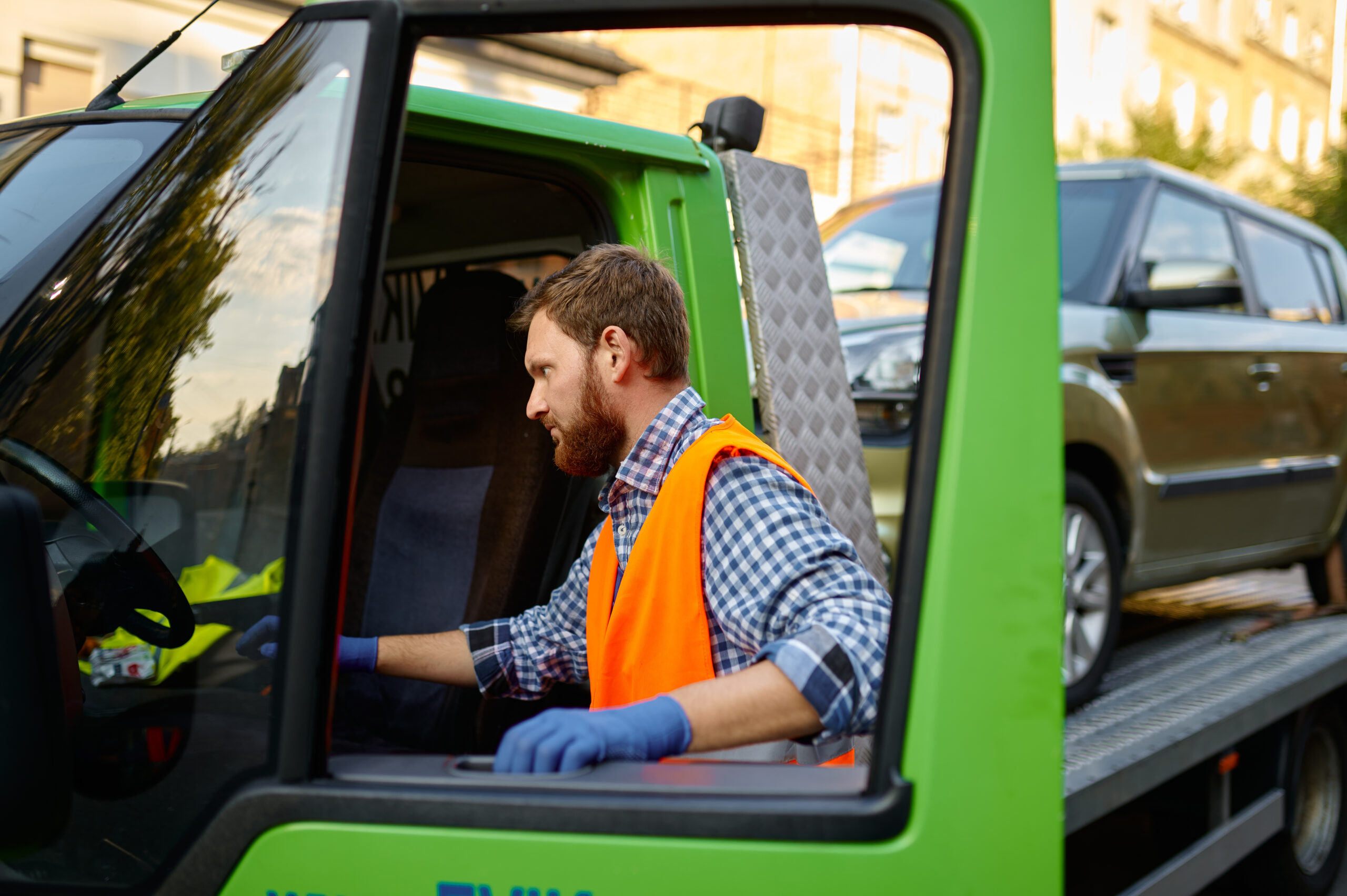 vehicle transporter driver preparing car for long distance car transport UK
