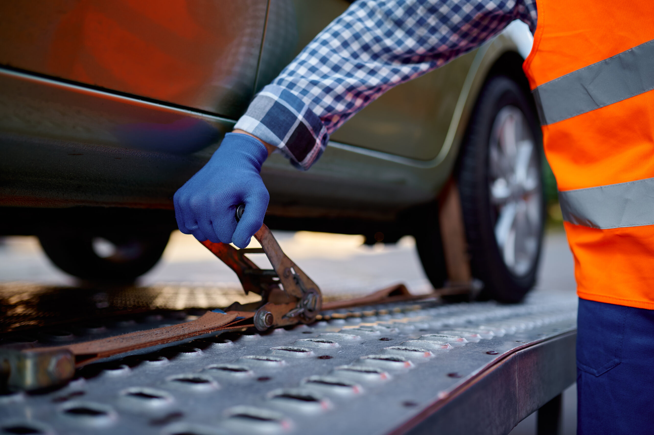 dealer vehicle transport UK securing car on transporter platform